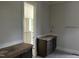Bathroom with gray tile floor, double vanity, and doorways to water closet and walk-in closet at 395 Meadow Walk Dr, Fuquay Varina, NC 27526