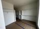 Walk-in closet with an abundance of custom white shelves, cabinets, and storage options at 395 Meadow Walk Dr, Fuquay Varina, NC 27526