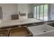 Bright living room with fireplace, gray cabinets, and sliding glass doors to deck at 395 Meadow Walk Dr, Fuquay Varina, NC 27526