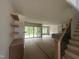 Open concept living room flows into kitchen and dining area with clear access to the rear deck at 395 Meadow Walk Dr, Fuquay Varina, NC 27526