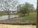Peaceful lakeside view with mature trees in a tranquil community at 395 Meadow Walk Dr, Fuquay Varina, NC 27526