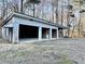 Spacious barn featuring multiple bay doors, ideal for storage or workshop at 4100 Durham Rd, Raleigh, NC 27614