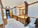 Bathroom featuring wood paneling, sink with granite countertop, and decorative wooden accents at 4100 Durham Rd, Raleigh, NC 27614