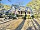 Charming exterior view of a well-maintained home featuring a welcoming front porch at 4100 Durham Rd, Raleigh, NC 27614