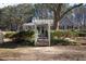 Charming home featuring a pergola entrance and well-maintained landscaping at 4100 Durham Rd, Raleigh, NC 27614