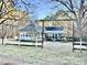 Charming home featuring large front yard with traditional fence and mature trees at 4100 Durham Rd, Raleigh, NC 27614