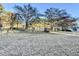 Gated entry to property through a beautifully manicured lawn at 4100 Durham Rd, Raleigh, NC 27614