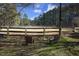 Outdoor horse arena or training area featuring wood fencing and seating at 4100 Durham Rd, Raleigh, NC 27614