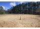 Spacious outdoor horse riding arena with sand and wooden perimeter fencing at 4100 Durham Rd, Raleigh, NC 27614