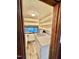 Functional laundry room with washer, dryer, and shelving for storage at 4100 Durham Rd, Raleigh, NC 27614