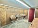 Tack room with wooden wall paneling and organized saddle and blanket storage at 4100 Durham Rd, Raleigh, NC 27614