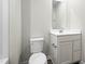 Bright bathroom with white vanity, mirror, and toilet at 417 Tormore Dr, Sanford, NC 27330