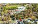 Aerial view of the home with a park and recreation area nearby, surrounded by mature trees at 518 Worth St, Raleigh, NC 27601