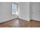 Bright, hardwood floored bedroom with a large window, offering ample natural light and comfortable living space at 518 Worth St, Raleigh, NC 27601