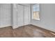 Cozy bedroom featuring hardwood floors, closet, and natural light, offering comfort and functionality at 518 Worth St, Raleigh, NC 27601