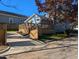 Charming blue home featuring a large wood deck, well-manicured lawn, and a private, gated driveway at 518 Worth St, Raleigh, NC 27601