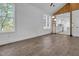 Bright living room featuring hardwood floors and a partial view of the modern kitchen at 518 Worth St, Raleigh, NC 27601