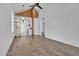 Open-concept living space showcasing hardwood floors and a modern kitchen in the background at 518 Worth St, Raleigh, NC 27601
