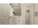 Well-lit bathroom featuring a double vanity and a separate shower, offering a spa-like experience at 532 Morning Light Dr, Angier, NC 27501