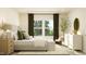 Relaxing bedroom featuring neutral decor, natural light, and ample seating near a window at 532 Morning Light Dr, Angier, NC 27501