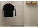 Walk-in closet features ample storage space, hanging racks and shelves for organization at 532 Morning Light Dr, Angier, NC 27501