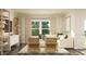 Bright living room featuring a comfortable sofa, stylish decor, and natural light at 532 Morning Light Dr, Angier, NC 27501