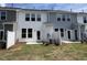 Backyard patio with lawn and privacy fence showcasing a well-maintained outdoor space at 6132 Arsenal Ave, Raleigh, NC 27610