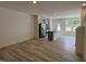 Open concept kitchen with granite countertops, stainless steel appliances, wood-look floors, and plenty of natural light at 6132 Arsenal Ave, Raleigh, NC 27610