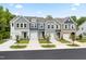 Charming new townhomes showcase varied exterior finishes and attached one car garages at 6134 Arsenal Ave, Raleigh, NC 27610