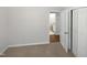 This bedroom shows an open door into a bathroom and closet at 6423 Whitt Rd, Durham, NC 27712