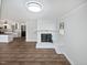 This living room offers a whitewashed brick fireplace and bench seating at 6423 Whitt Rd, Durham, NC 27712
