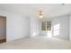 Carpeted bedroom with built in closet, ceiling fan and window with natural light at 69 Holly Tree Dr, Timberlake, NC 27583