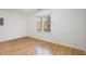 Bedroom with hardwood floors, white walls, and natural light from window at 69 Holly Tree Dr, Timberlake, NC 27583