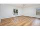 Bright, airy bedroom with hardwood flooring, large windows and crown molding at 69 Holly Tree Dr, Timberlake, NC 27583