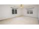 Spacious bedroom featuring two windows that provide natural light and ceiling fan at 69 Holly Tree Dr, Timberlake, NC 27583