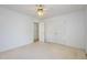 A bright bedroom features plush carpet, double closet, and a view to the hallway at 69 Holly Tree Dr, Timberlake, NC 27583