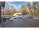 Expansive wooden deck overlooking a large, grassy backyard and detached garage at 69 Holly Tree Dr, Timberlake, NC 27583