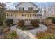 Charming two-story home featuring a wrap-around porch and well-manicured landscaping at 69 Holly Tree Dr, Timberlake, NC 27583