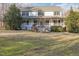 A beautiful two-story home with a covered front porch, perfect for enjoying the outdoors at 69 Holly Tree Dr, Timberlake, NC 27583