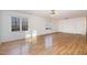 Spacious living room featuring hardwood floors, white walls, and multiple windows at 69 Holly Tree Dr, Timberlake, NC 27583