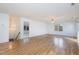 Open living area featuring hardwood floors and ample natural light at 69 Holly Tree Dr, Timberlake, NC 27583