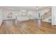Open-concept living space with a kitchen island, hardwood floors, and plenty of room at 69 Holly Tree Dr, Timberlake, NC 27583