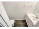 Clean powder room with neutral walls and a single vanity with white cabinets at 7104 Proctor Hill Dr, Raleigh, NC 27613