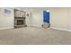 Large basement with neutral carpet features a stone fireplace, small windows, and stairs at 1013 Timber Mist Ct, Cary, NC 27519