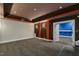 Finished basement with neutral carpet, two-tone paint, and open floor plan at 1013 Timber Mist Ct, Cary, NC 27519