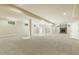 Very large finished basement has neutral paint and carpet, recessed lighting, and support beams at 1013 Timber Mist Ct, Cary, NC 27519