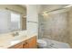 Well-lit bathroom featuring tile shower and vanity sink at 1013 Timber Mist Ct, Cary, NC 27519
