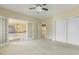 Bright bedroom features an open doorway, a ceiling fan with lighting and a double door closet at 1013 Timber Mist Ct, Cary, NC 27519
