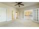 Bright bedroom features three door openings and ceiling fan at 1013 Timber Mist Ct, Cary, NC 27519