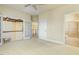 Open bedroom area with multiple doors to hallway and bathroom at 1013 Timber Mist Ct, Cary, NC 27519